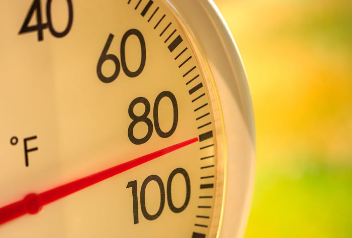 Outdoor thermometer showing a hot summer temperature